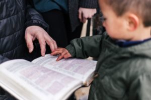 Child reads Bible